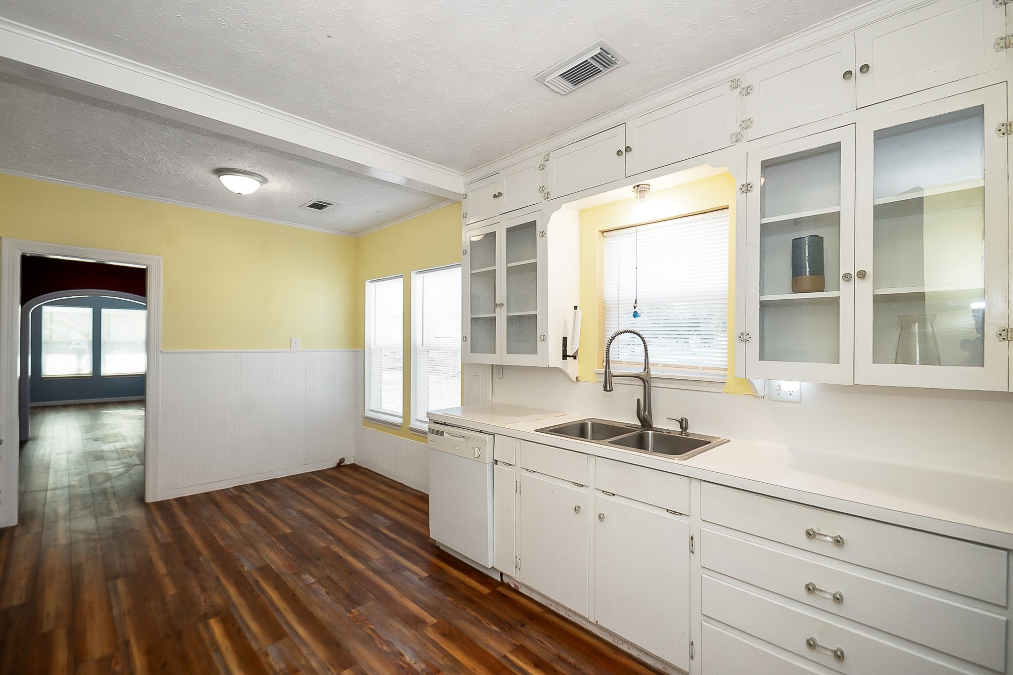 109 Maple Street Highlands, TX 77562 - Photo 19 of 50 a kitchen with a sink and wooden floor