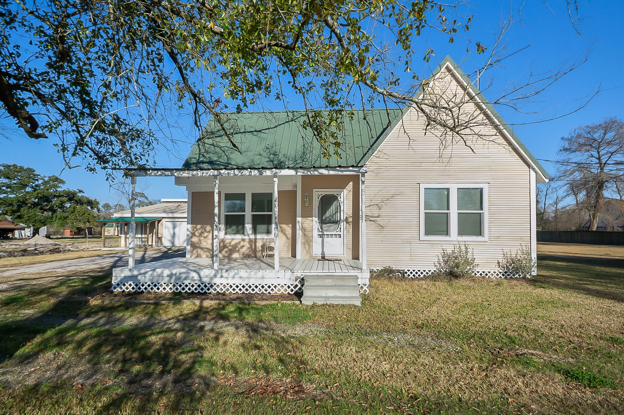 109 Maple Street Highlands, TX 77562 - Photo 2 of 50 a front view of a house with garden