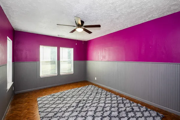 a room with window and a ceiling fan