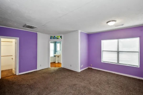 a view of a livingroom with an empty space and window
