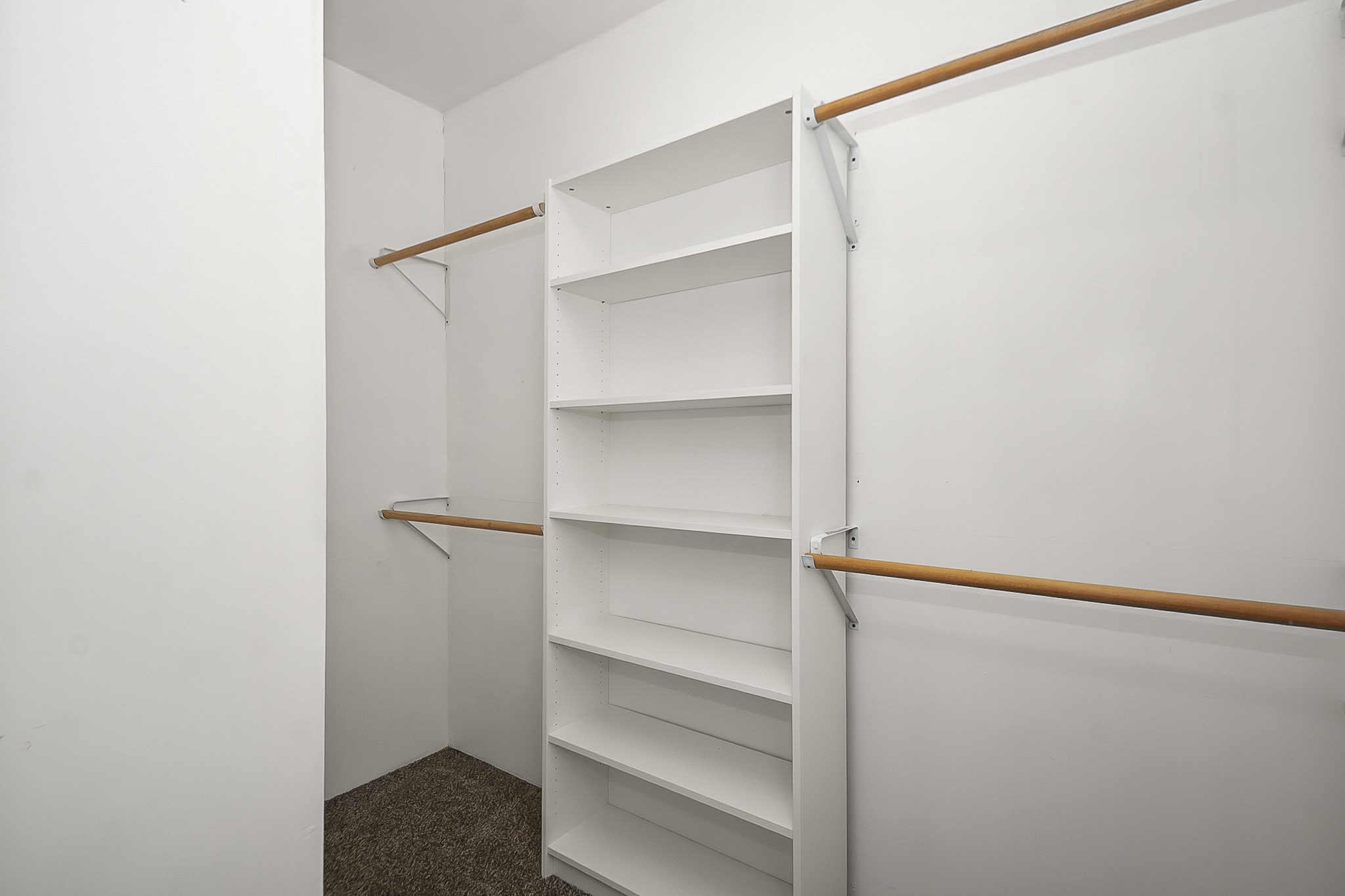 109 Maple Street Highlands, TX 77562 - Photo 37 of 50 a view of walk in closet with empty racks