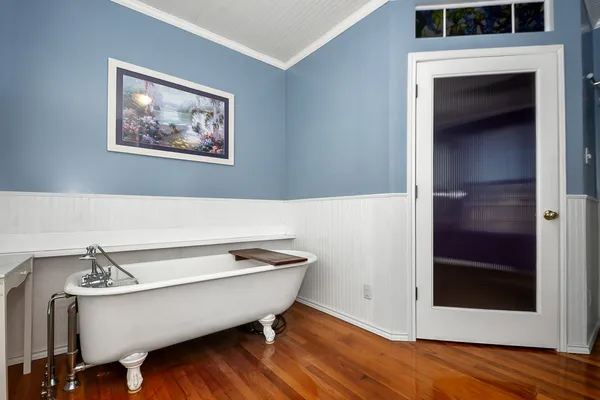 a bathroom with a bathtub and a sink