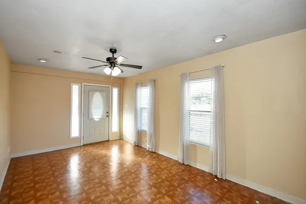 a view of an empty room with a window
