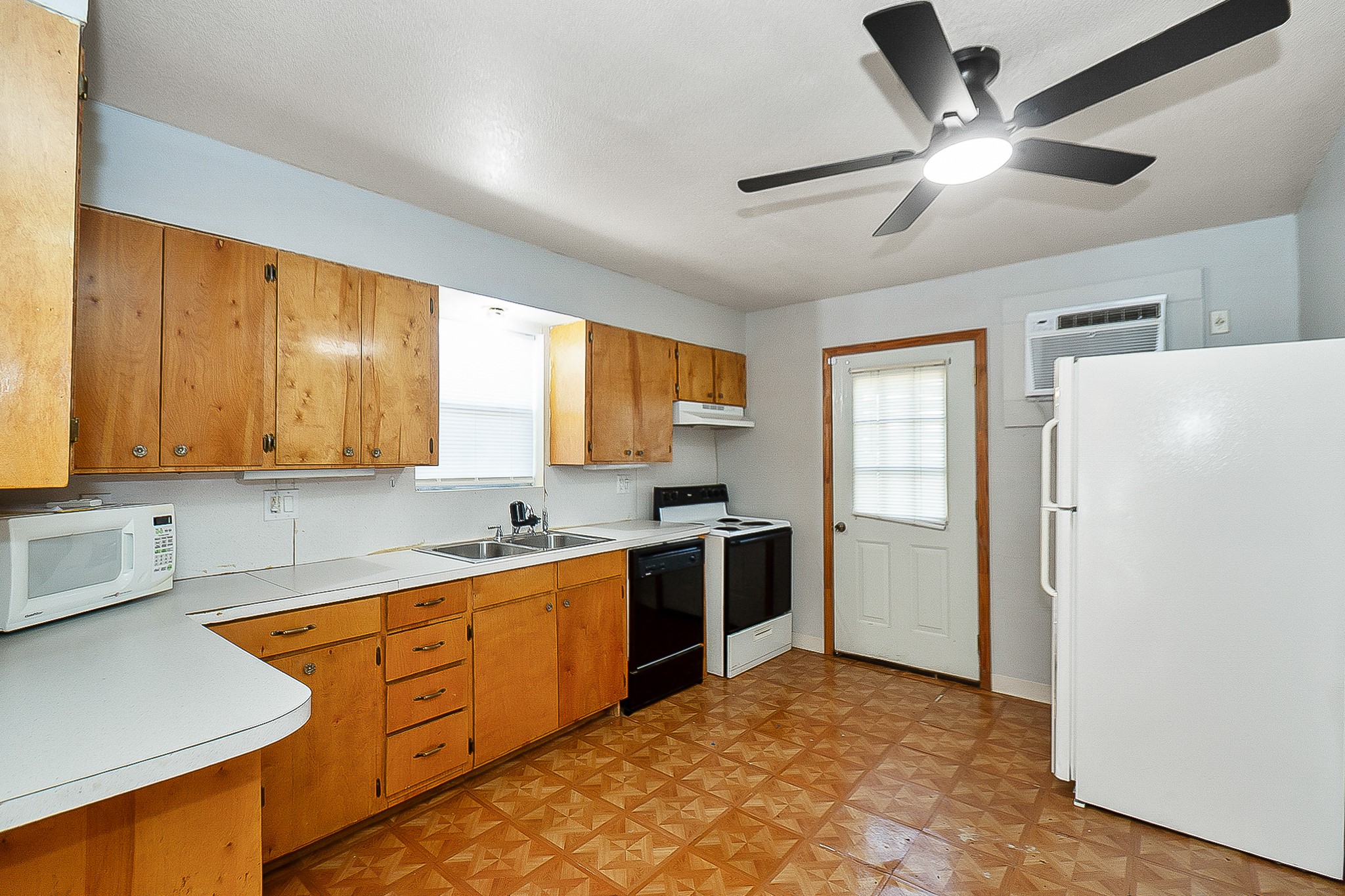 109 Maple Street Highlands, TX 77562 - Photo 47 of 50 a kitchen with stainless steel appliances granite countertop a sink a stove and a refrigerator