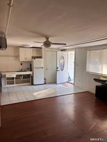 a view of a kitchen with a sink and a stove top oven