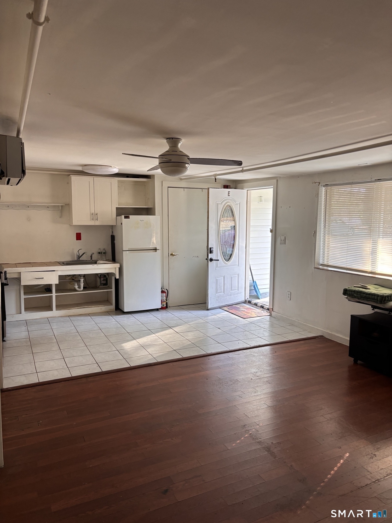 a view of a kitchen with a sink and a stove top oven