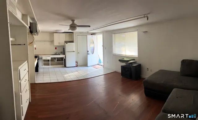 a kitchen with granite countertop a stove and a refrigerator