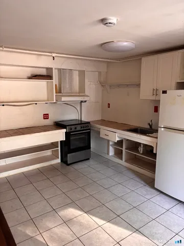 a kitchen with stainless steel appliances cabinets and a sink