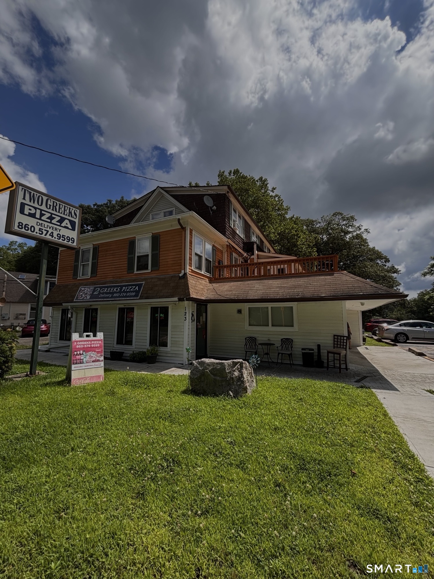 123 Old Norwich Road Quaker Hill, CT 06375 - Photo 6 of 7 a front view of a house with garden