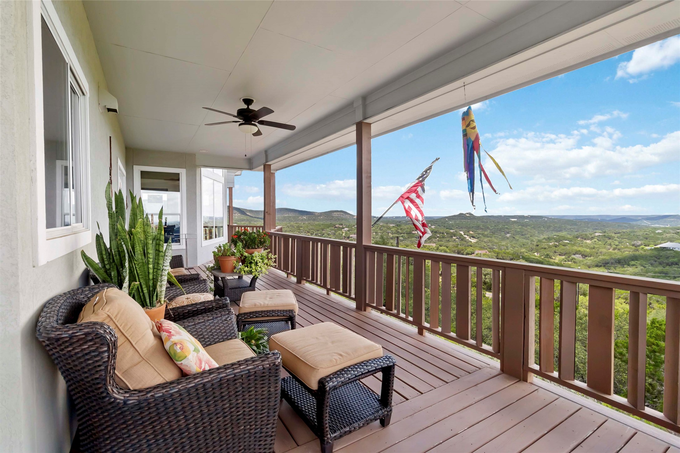 633 Flaman Road Canyon Lake, TX 78133 - Photo 11 of 40 a balcony with wooden floor stairs and furniture