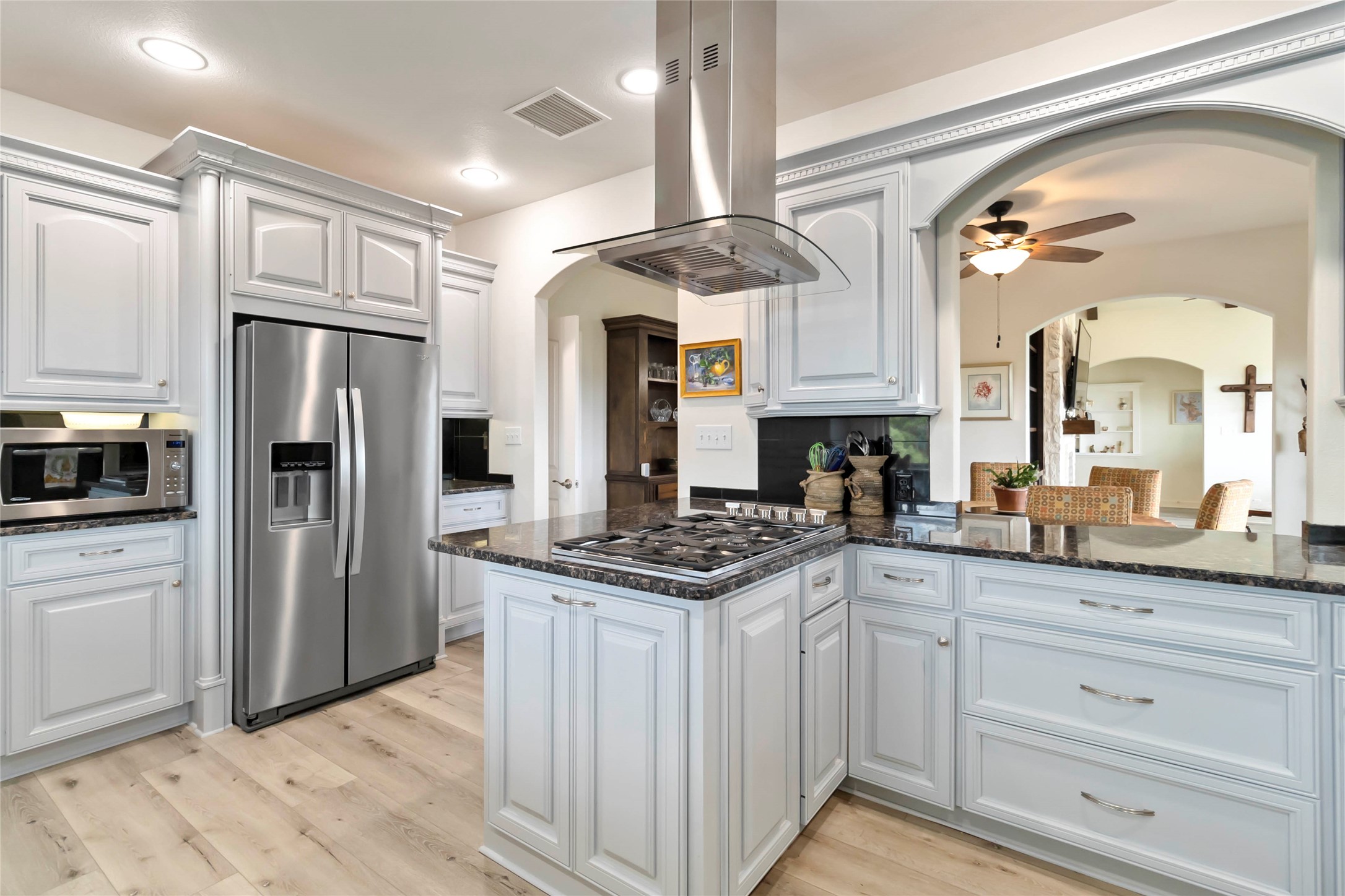 633 Flaman Road Canyon Lake, TX 78133 - Photo 13 of 40 a kitchen with granite countertop a stove oven and refrigerator