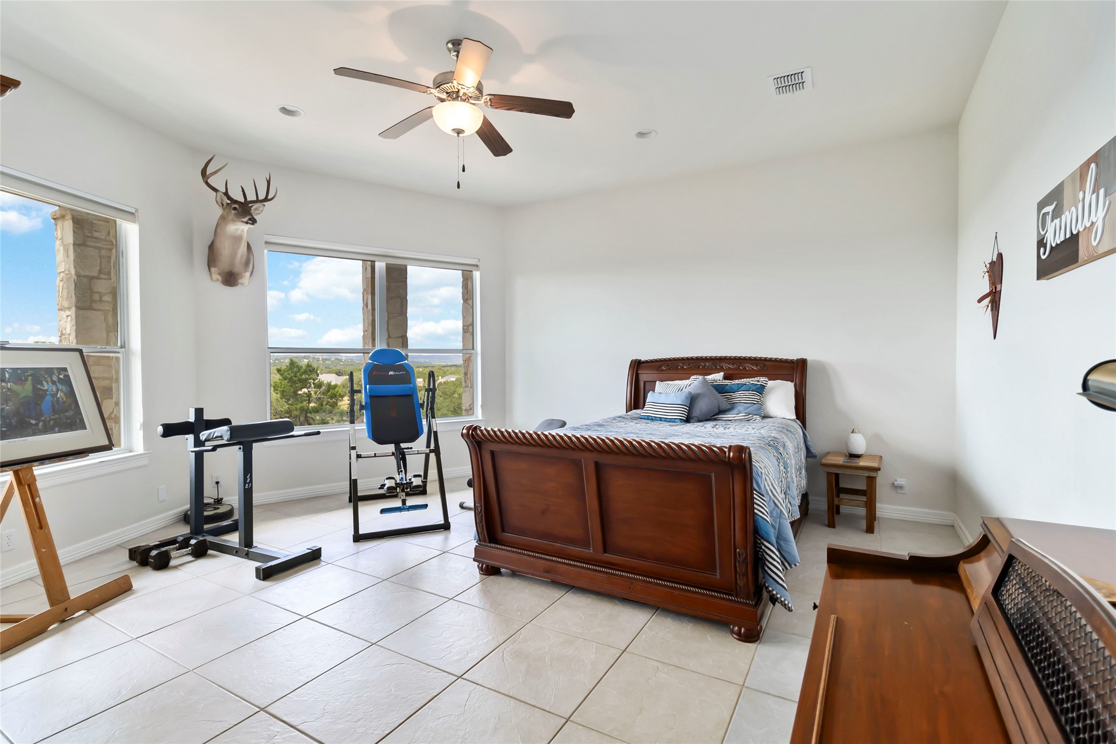 633 Flaman Road Canyon Lake, TX 78133 - Photo 21 of 40 a bedroom with furniture and a window