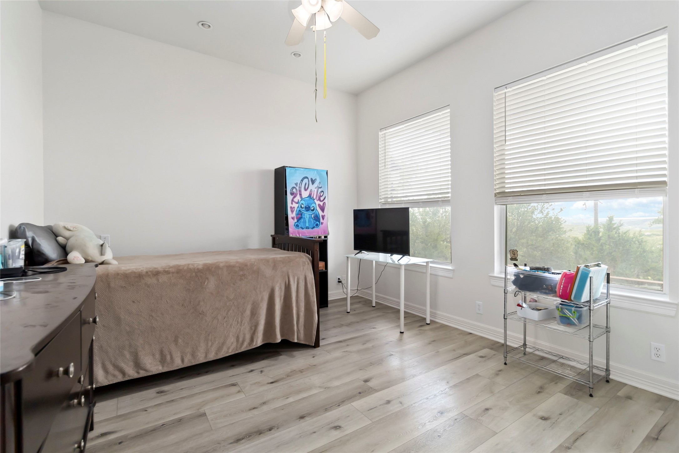 633 Flaman Road Canyon Lake, TX 78133 - Photo 23 of 40 a bedroom with a bed and a flat screen tv