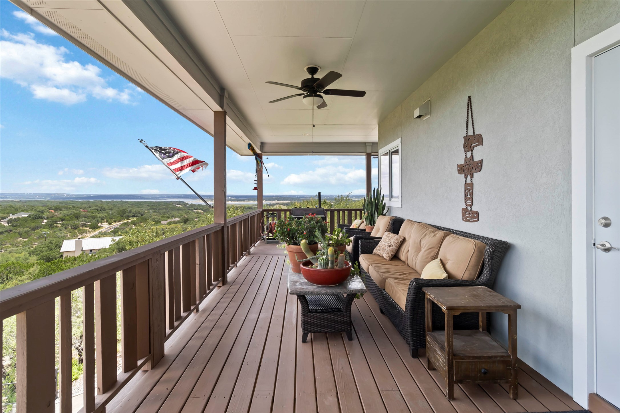 633 Flaman Road Canyon Lake, TX 78133 - Photo 3 of 40 a balcony with wooden floor and outdoor seating