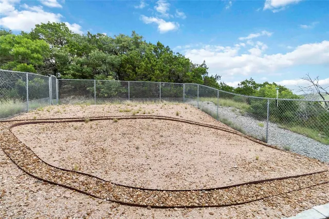 a view of a wooden floor with a fence