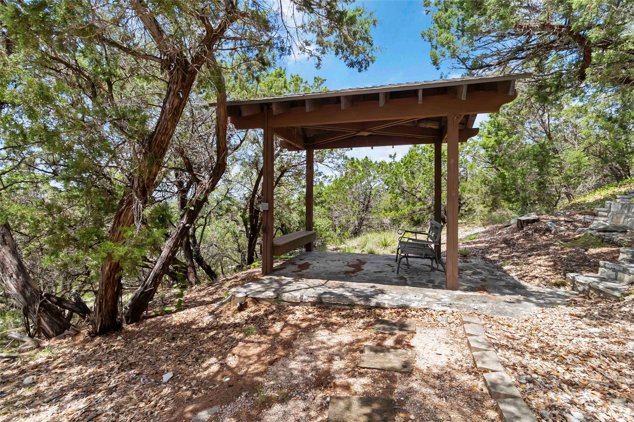 633 Flaman Road Canyon Lake, TX 78133 - Photo 36 of 40 a view of a yard with wooden fence and large trees