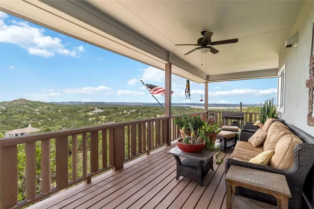 a view of a balcony with furniture