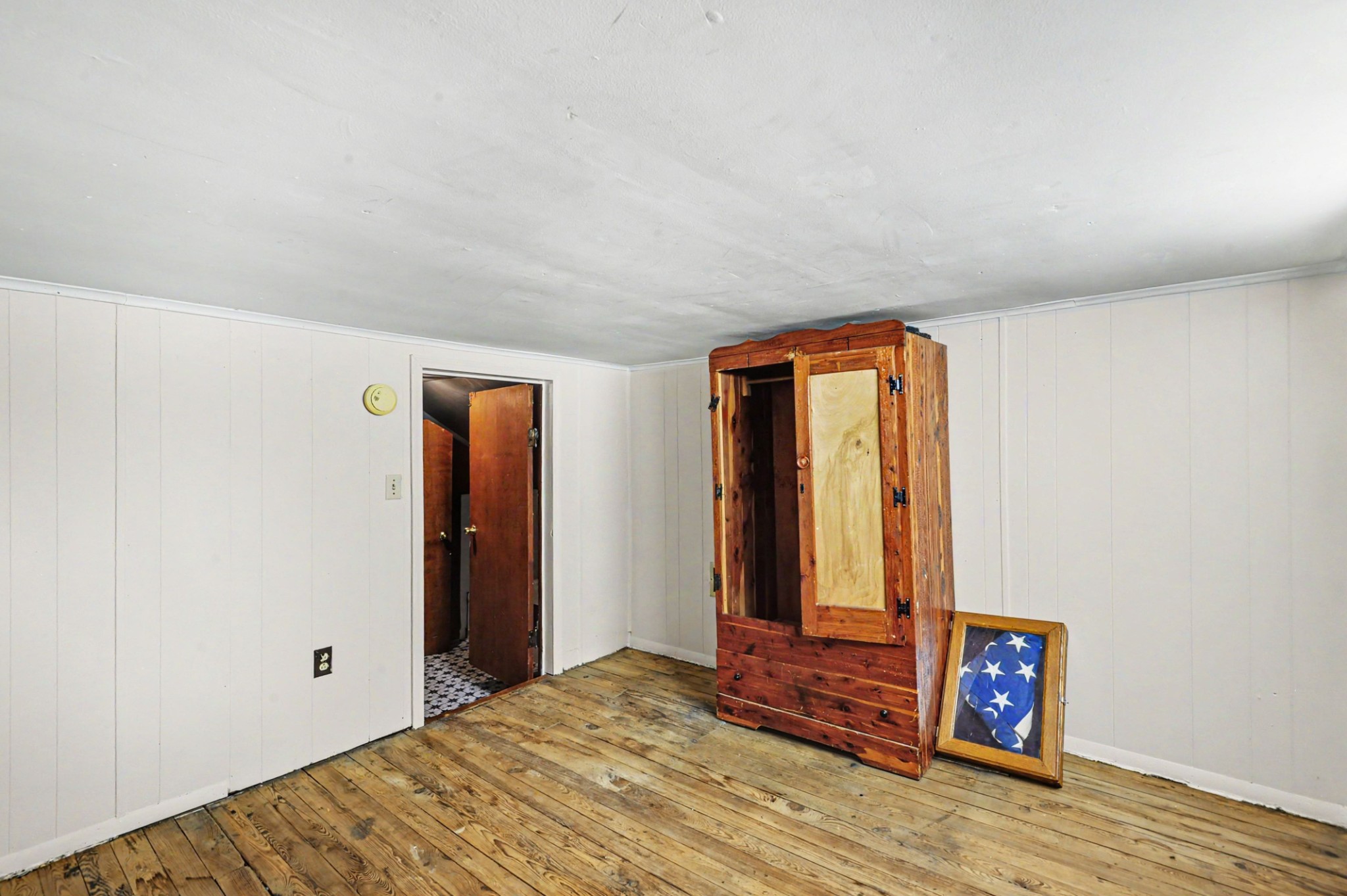 1241 Butler Bridge Road Portland, TN 37148 - Photo 12 of 15 a view of an empty room with wooden floor and a window