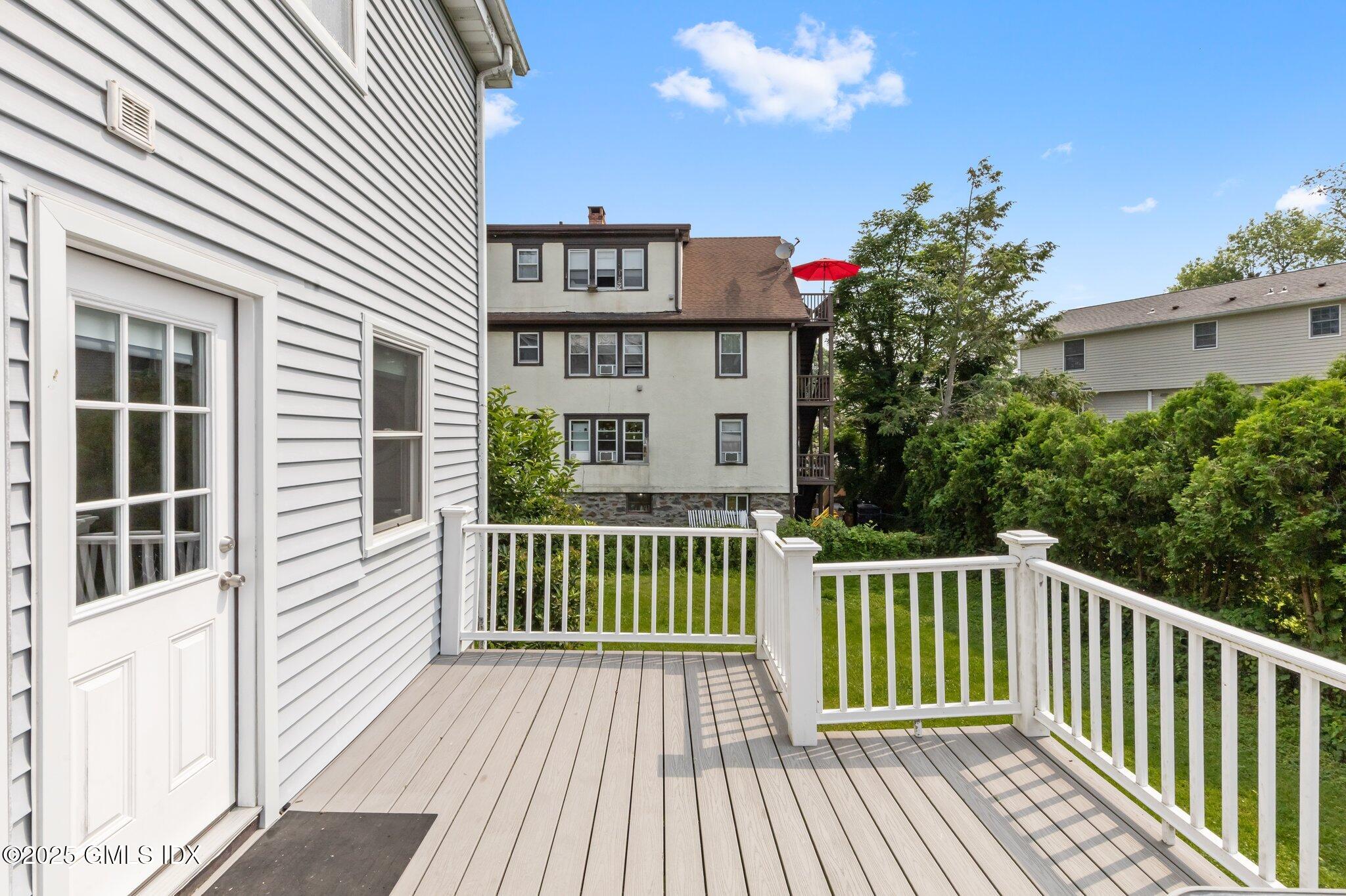 79 Hamilton Avenue, Unit B Greenwich, CT 06830 - Photo 13 of 18 a view of a house with a deck