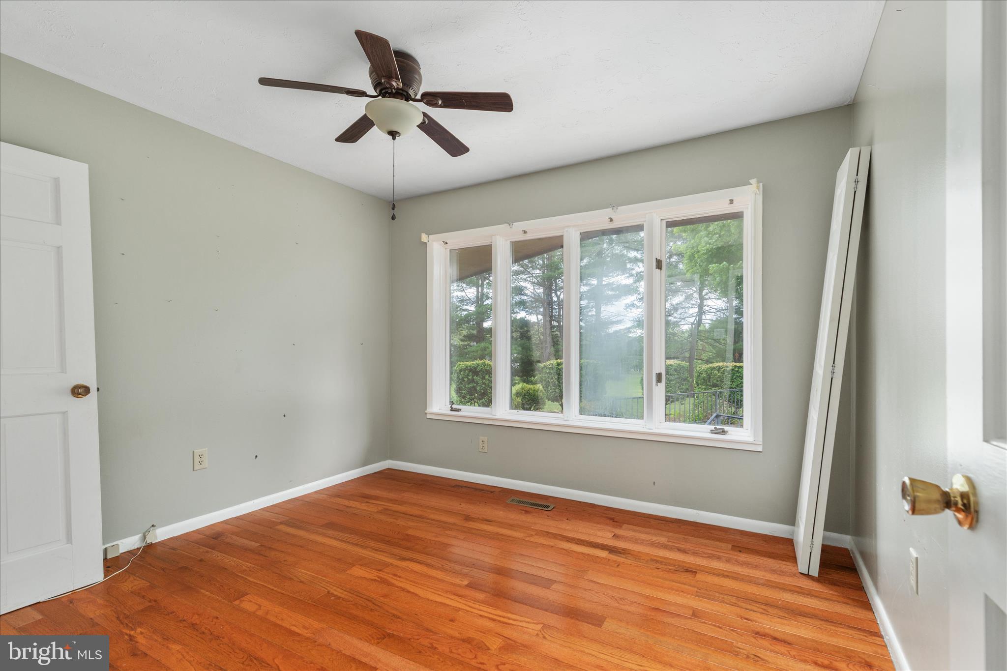 263 Bowling Green Road Front Royal, VA 22630 - Photo 14 of 75 a view of empty room with wooden floor and fan