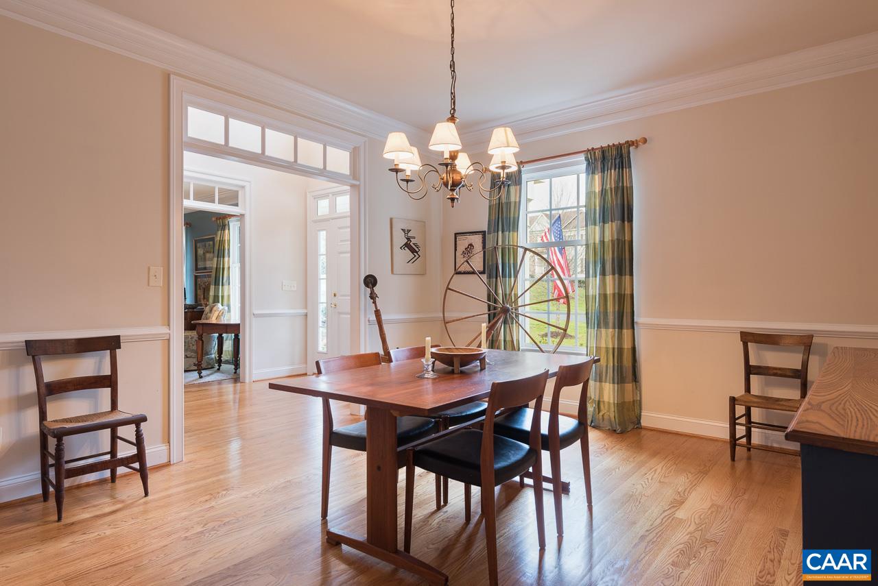 3392 Darby Road Keswick, VA 22947 - Photo 5 of 23 a view of a dining room with furniture wooden floor and chandelier