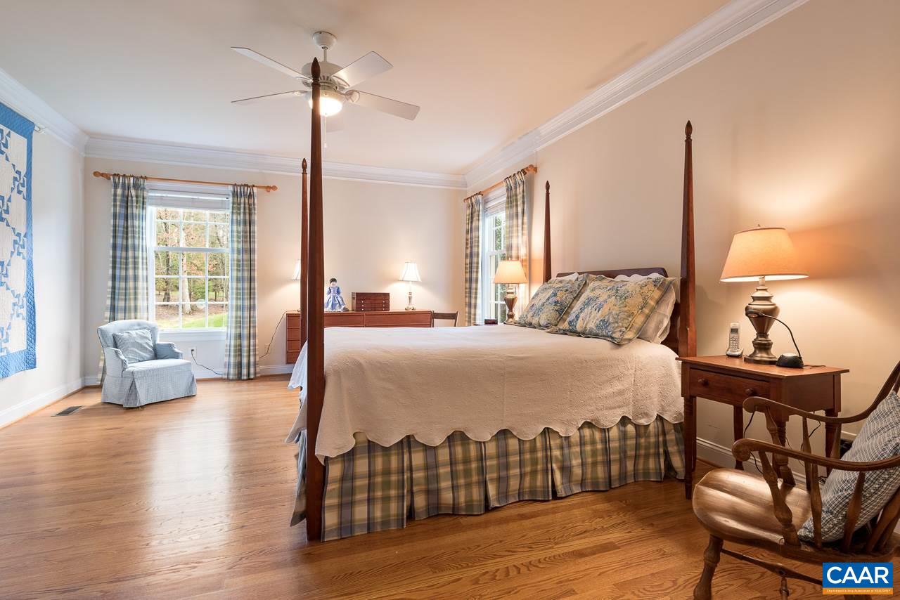 3392 Darby Road Keswick, VA 22947 - Photo 8 of 23 a bedroom with a bed and wooden floor
