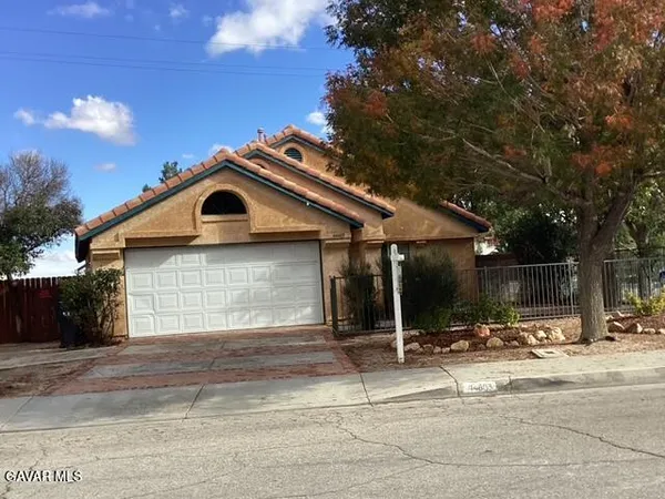 a front view of a house with a outdoor space