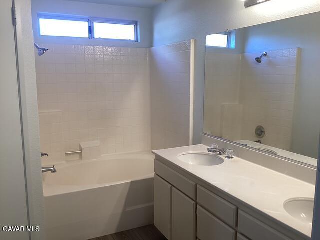 44603 Palm Lane Lancaster, CA 93535 - Photo 15 of 18 a bathroom with a sink and a mirror