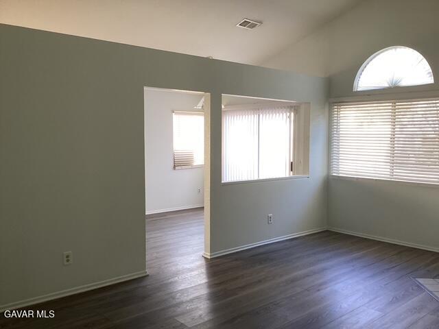 44603 Palm Lane Lancaster, CA 93535 - Photo 3 of 18 an empty room with wooden floor and windows
