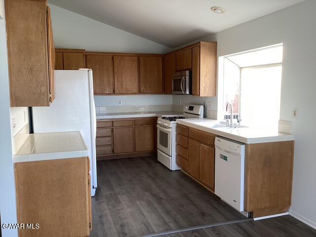 44603 Palm Lane Lancaster, CA 93535 - Photo 5 of 18 a kitchen with a sink stove and cabinets