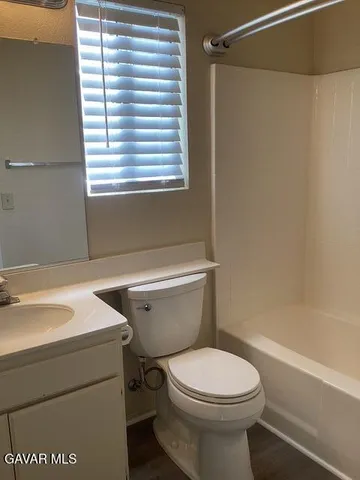 a bathroom with a sink a toilet and a bathtub
