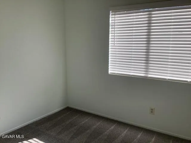 a view of a room that has a window in it