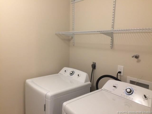 3994 Northwest Cinnamon Tree Circle Jensen Beach, FL 34957 - Photo 11 of 14 a utility room with dryer and washer