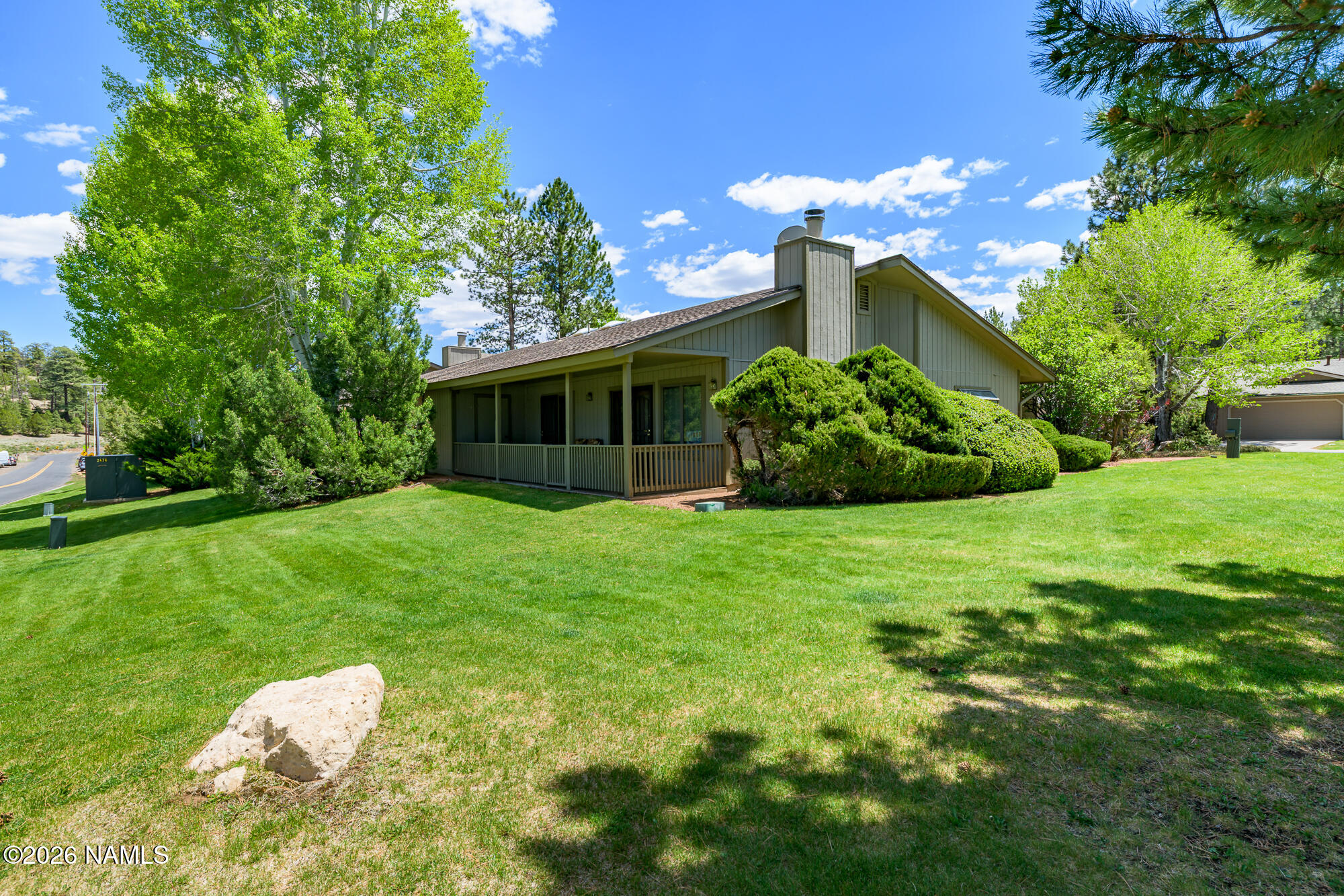 6000 East Laurel Loop, Unit 11 Flagstaff, AZ 86004 - Photo 1 of 54 a view of a house with a backyard