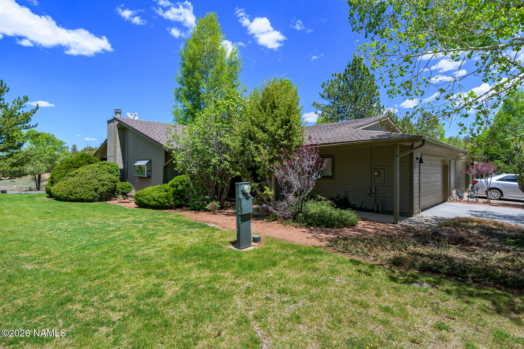6000 East Laurel Loop, Unit 11 Flagstaff, AZ 86004 - Photo 12 of 54 a backyard of a house with lots of green space