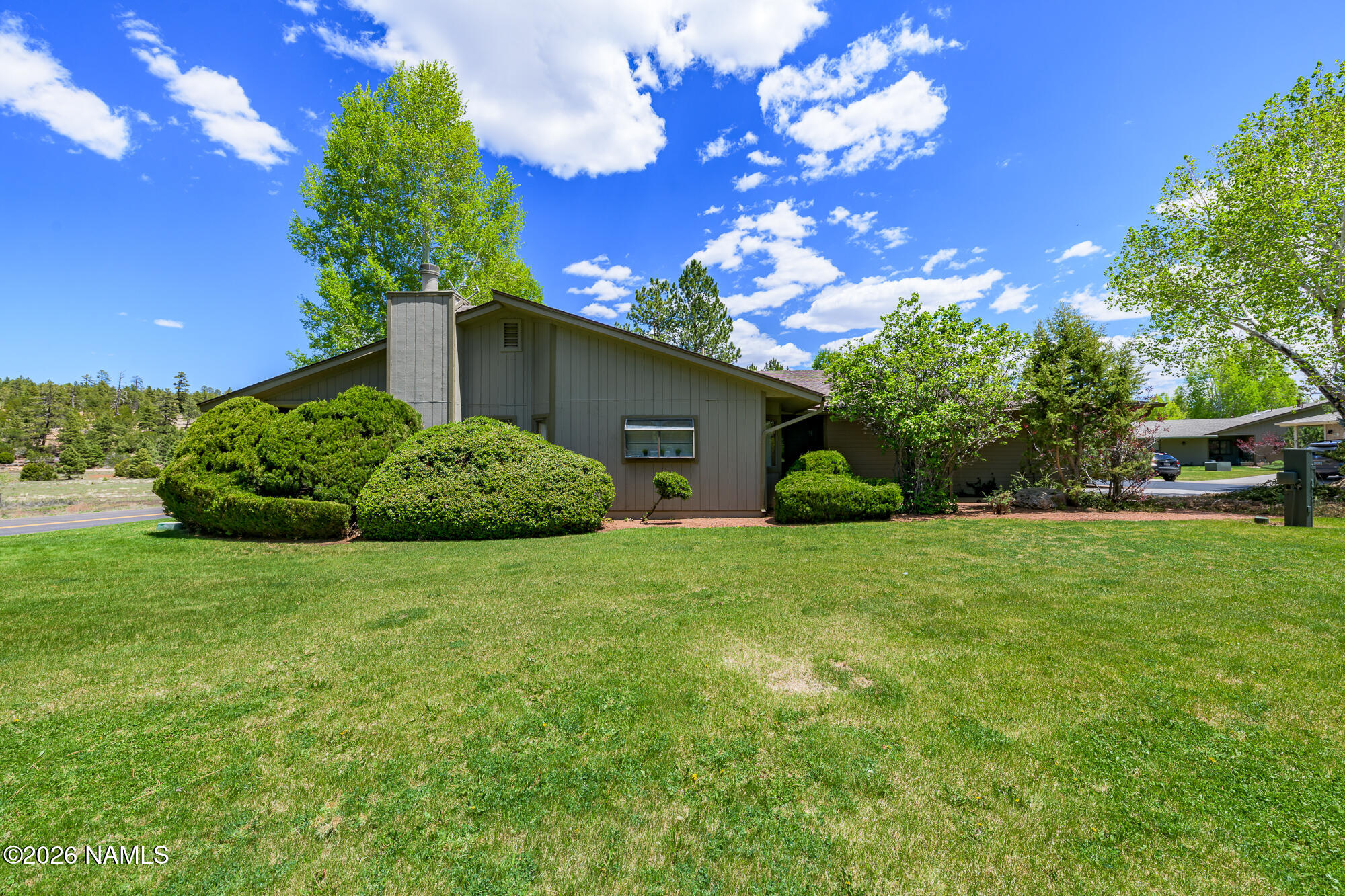 6000 East Laurel Loop, Unit 11 Flagstaff, AZ 86004 - Photo 13 of 54 a backyard of a house with lots of green space