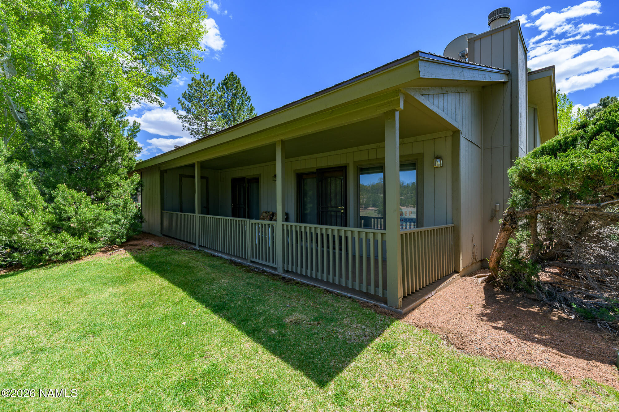 6000 East Laurel Loop, Unit 11 Flagstaff, AZ 86004 - Photo 14 of 54 a view of a house with yard and plants
