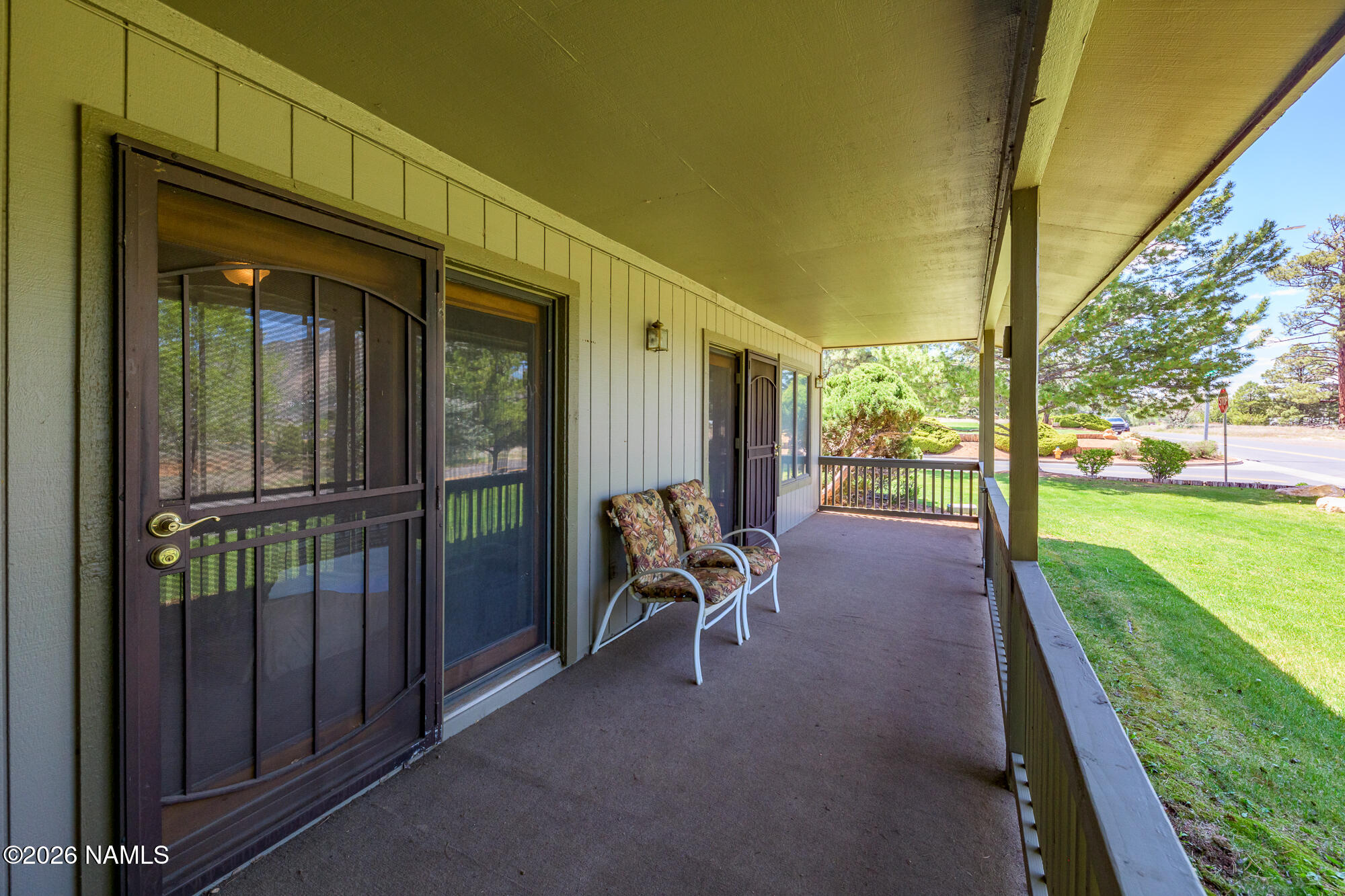 6000 East Laurel Loop, Unit 11 Flagstaff, AZ 86004 - Photo 16 of 54 a view of a porch with chairs and yard