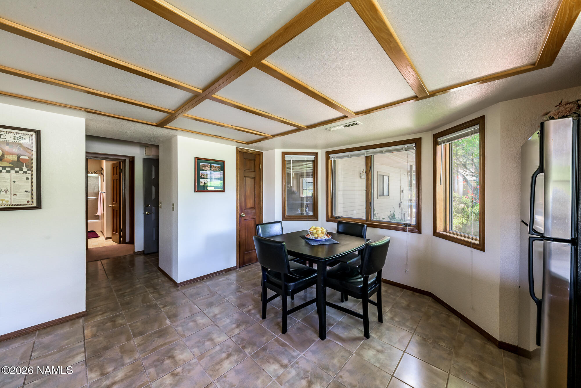 6000 East Laurel Loop, Unit 11 Flagstaff, AZ 86004 - Photo 19 of 54 a dining room with furniture and window