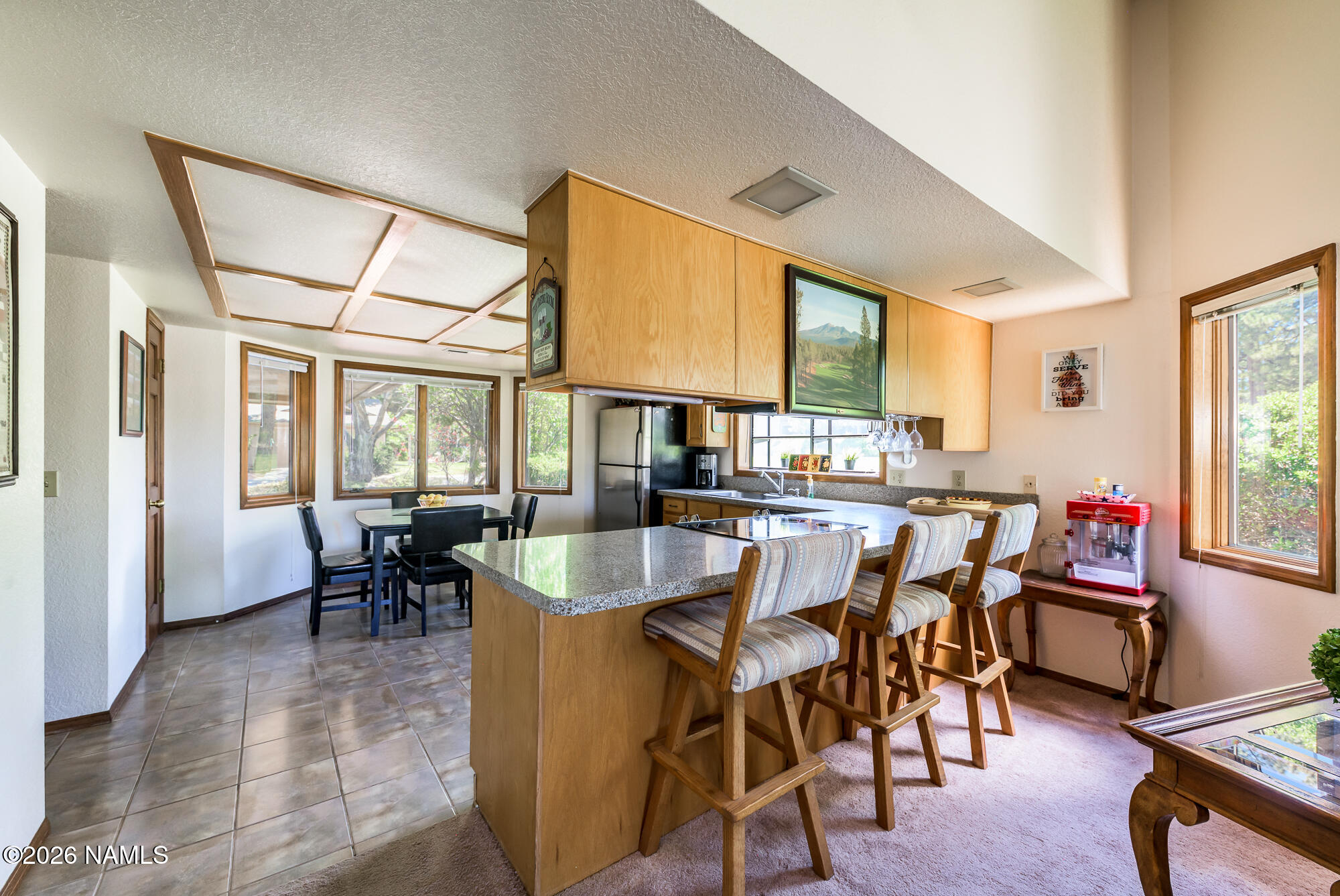 6000 East Laurel Loop, Unit 11 Flagstaff, AZ 86004 - Photo 22 of 54 a dining room with furniture a couch and wooden floor