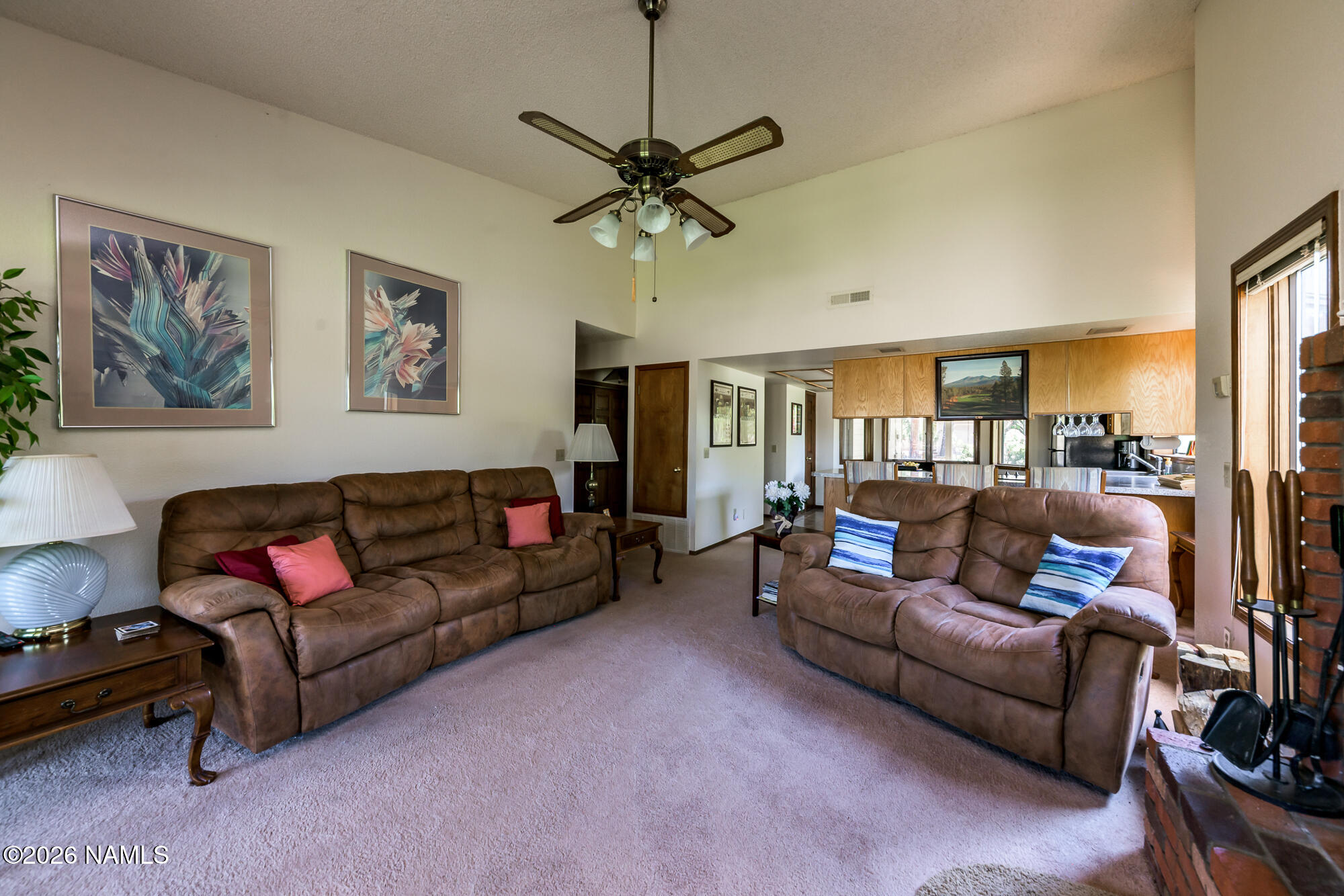 6000 East Laurel Loop, Unit 11 Flagstaff, AZ 86004 - Photo 25 of 54 a living room with furniture a ceiling fan and a window