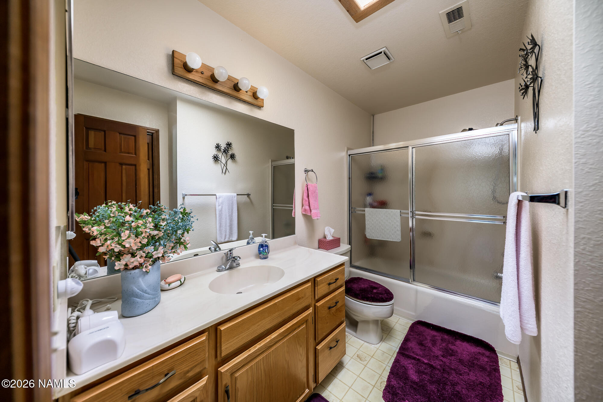 6000 East Laurel Loop, Unit 11 Flagstaff, AZ 86004 - Photo 28 of 54 a bathroom with a sink a toilet and shower