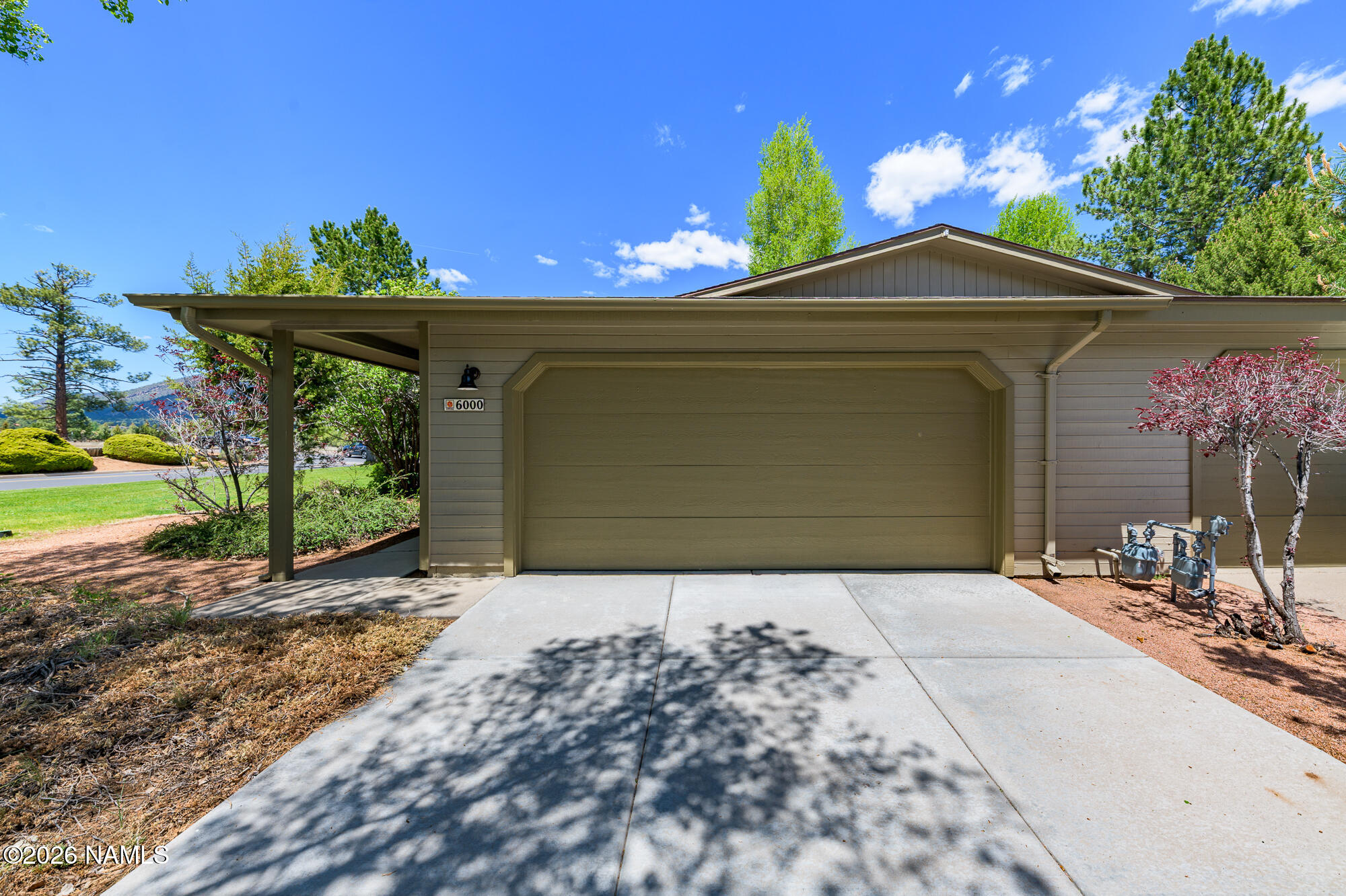 6000 East Laurel Loop, Unit 11 Flagstaff, AZ 86004 - Photo 35 of 54 a view of a house with a yard