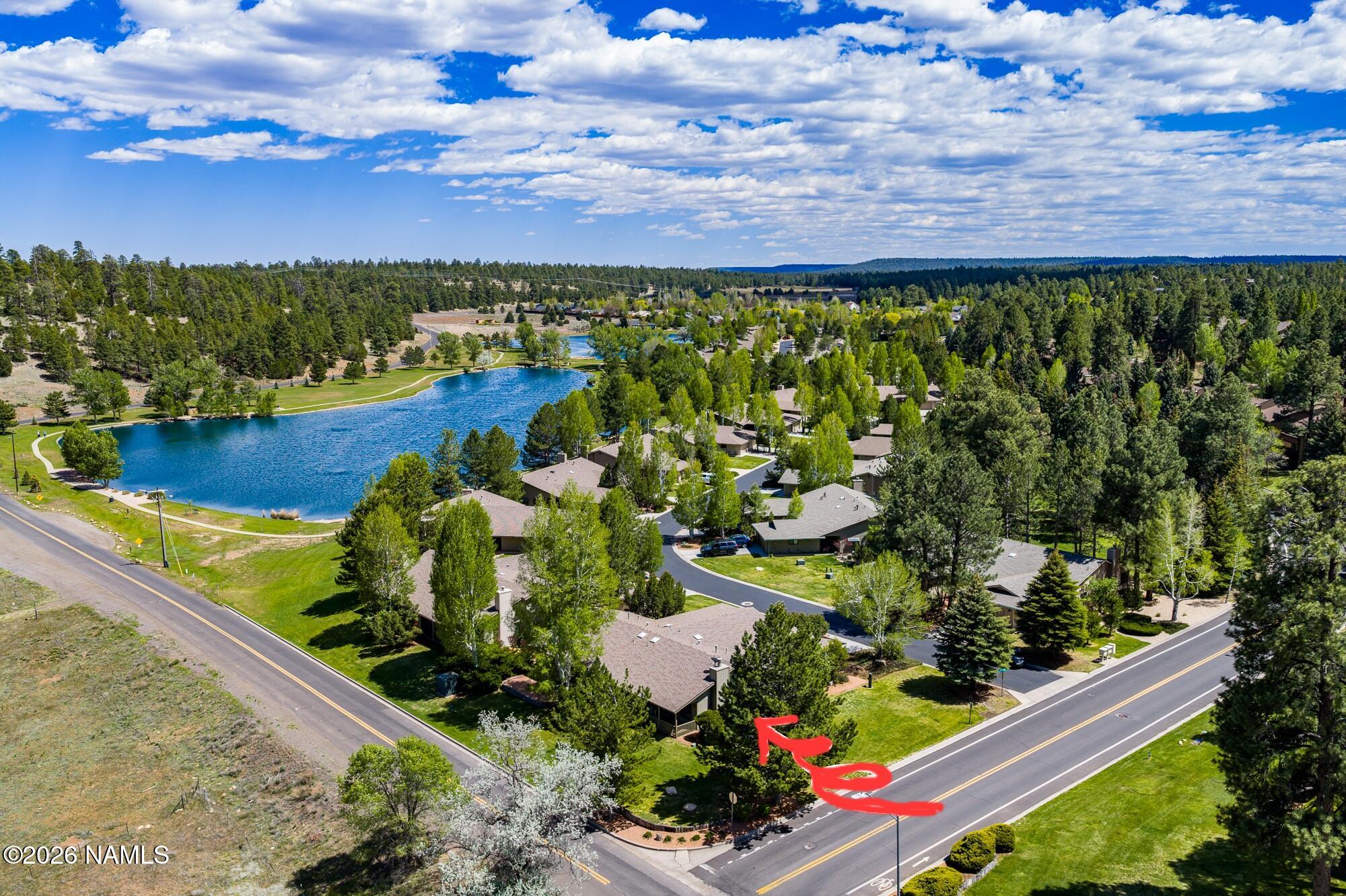 6000 East Laurel Loop, Unit 11 Flagstaff, AZ 86004 - Photo 3 of 54 a view of a garden with a lake