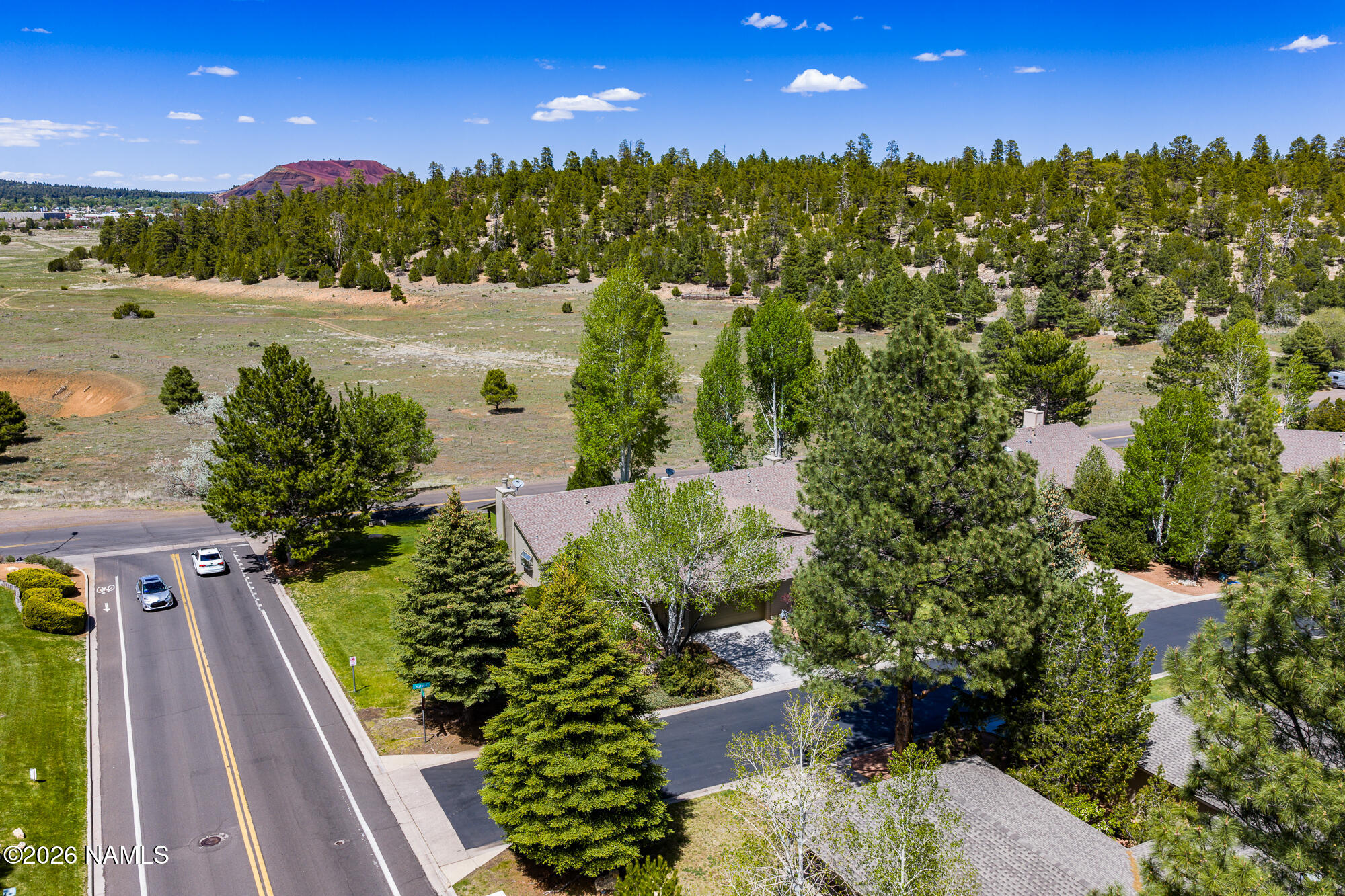 6000 East Laurel Loop, Unit 11 Flagstaff, AZ 86004 - Photo 40 of 54 a view of a pathway both side of building with yard