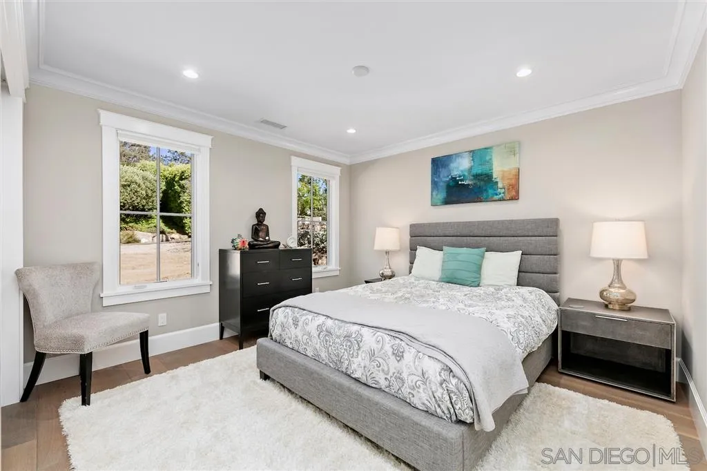 1622 Forest Way Del Mar, CA 92014 - Photo 13 of 25 a bedroom with a large bed and a window