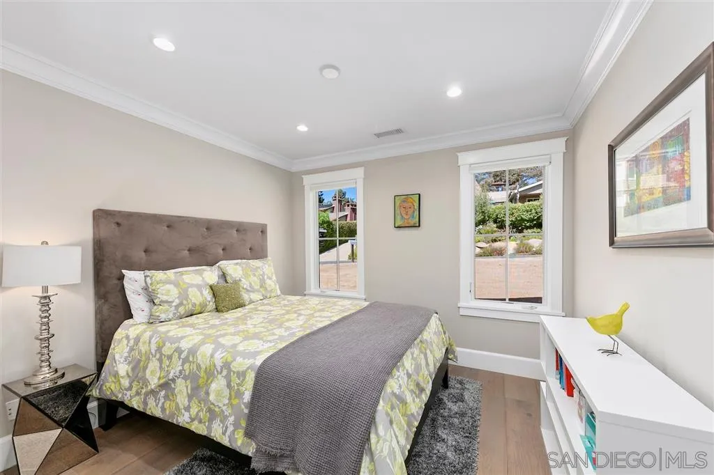 1622 Forest Way Del Mar, CA 92014 - Photo 14 of 25 a bedroom with a bed and wooden floor