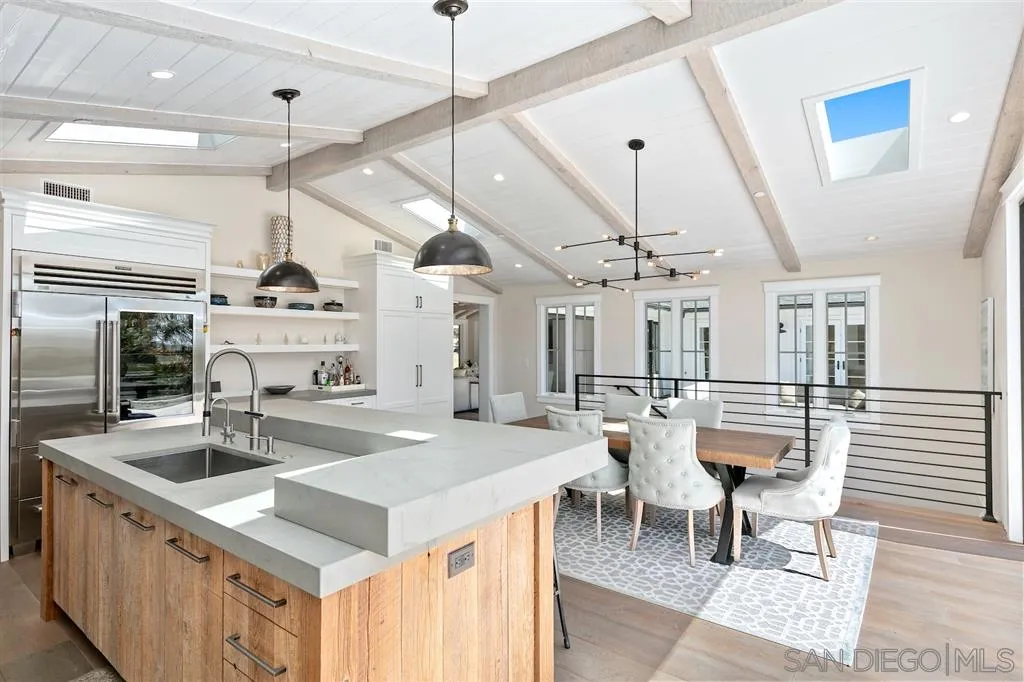 1622 Forest Way Del Mar, CA 92014 - Photo 6 of 25 a kitchen with stainless steel appliances granite countertop a sink a stove and chairs