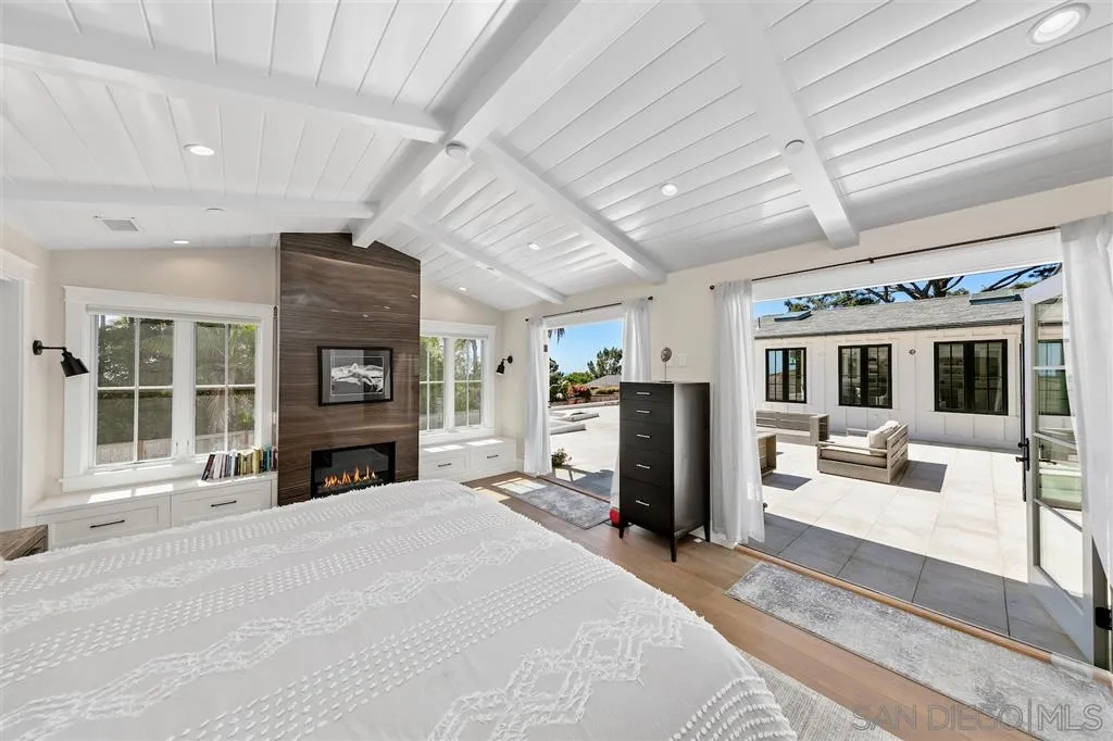 1622 Forest Way Del Mar, CA 92014 - Photo 8 of 25 a large bedroom with furniture fireplace and a large window