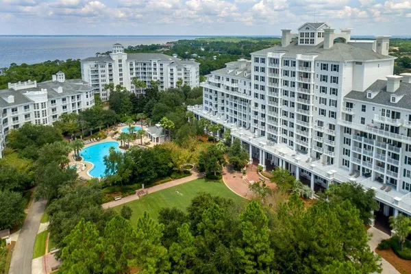 a view of a swimming pool with a yard